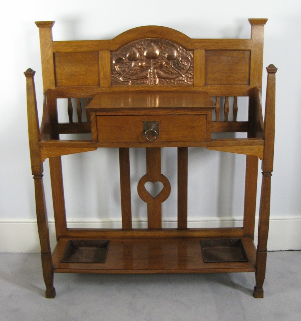 Arts and Crafts hall stick stand in oak with copper panel by Shapland and Petter of Barnstaple