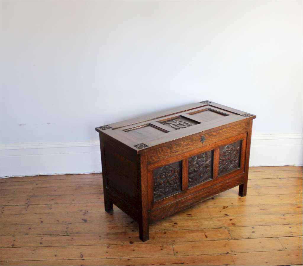 Arts and Crafts oak blanket box with carved panels