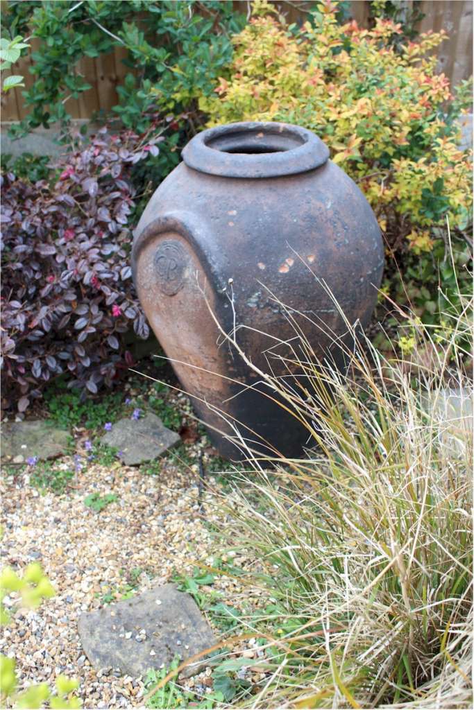 Large antique European olive terracotta garden urn measuring 84 cm high x 55 cm diam.