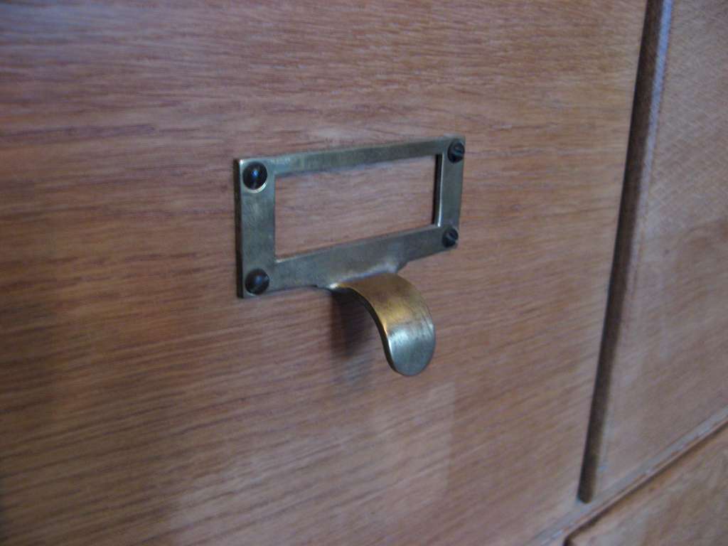 Oak sectional filing cabinet with brass pulls