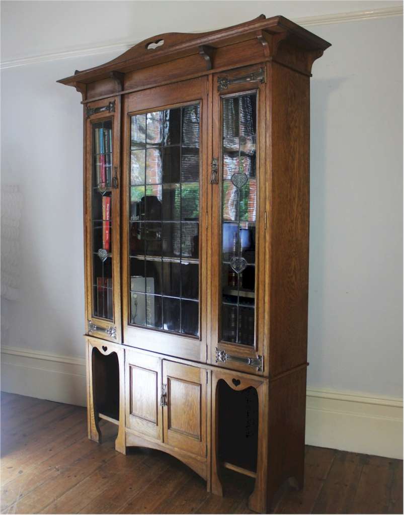Arts and Crafts glazed bookcase with hearts