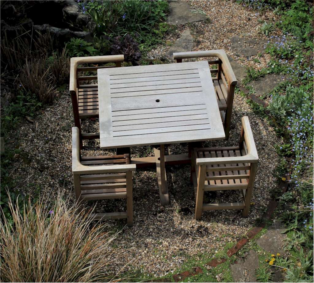 Teak garden table and four corner chairs