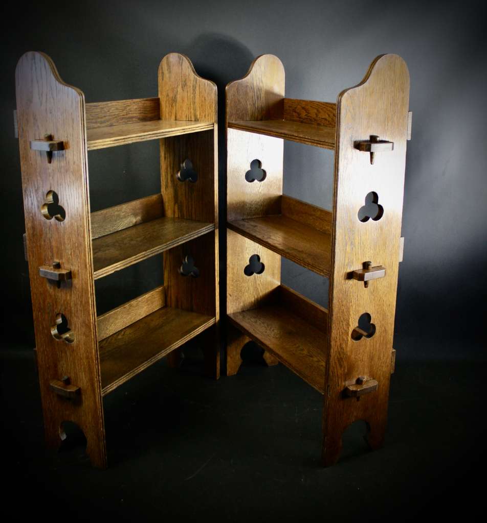 A Pair of Arts and Crafts oak open bookshelves,