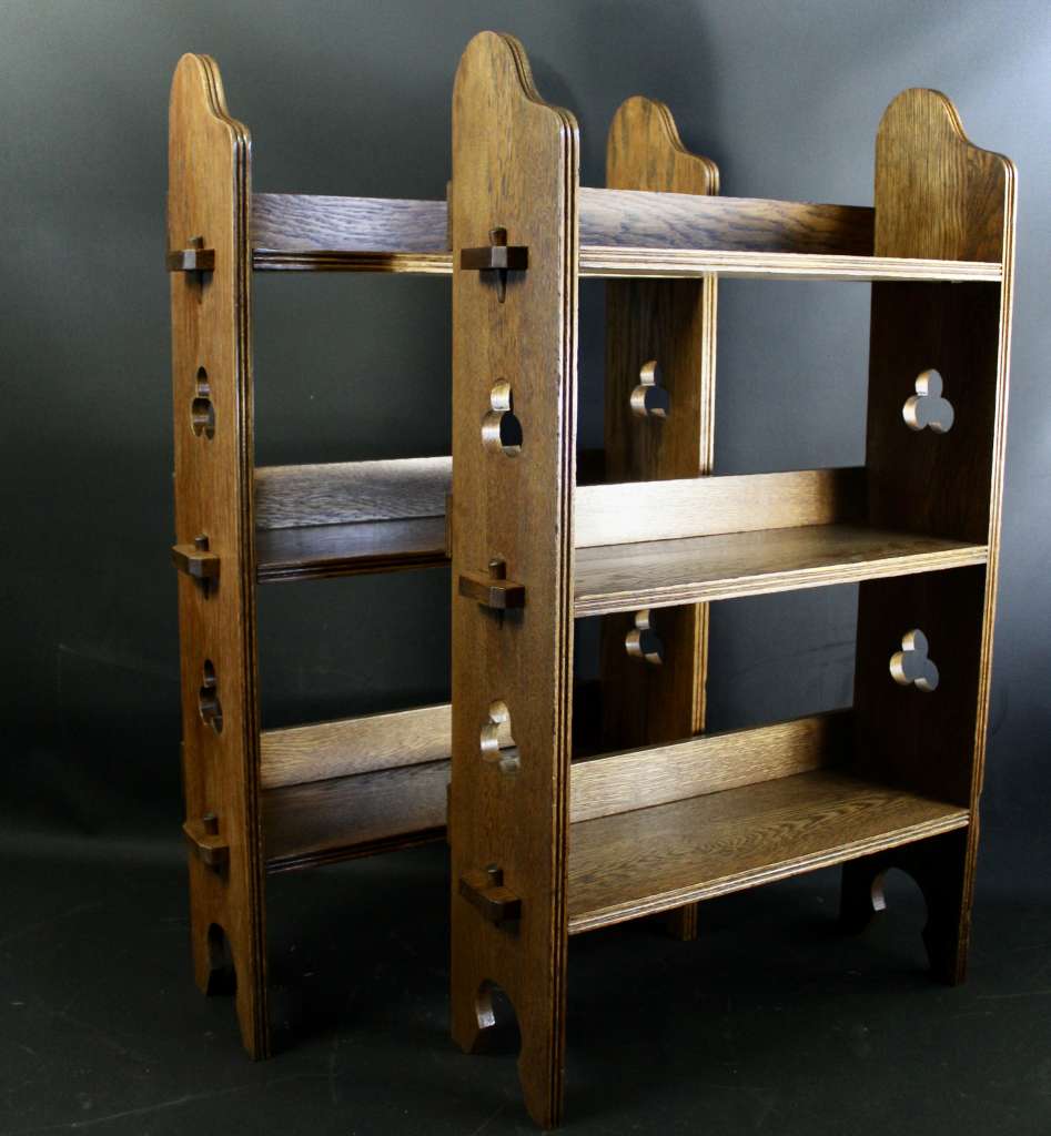 A Pair of Arts and Crafts oak open bookshelves,