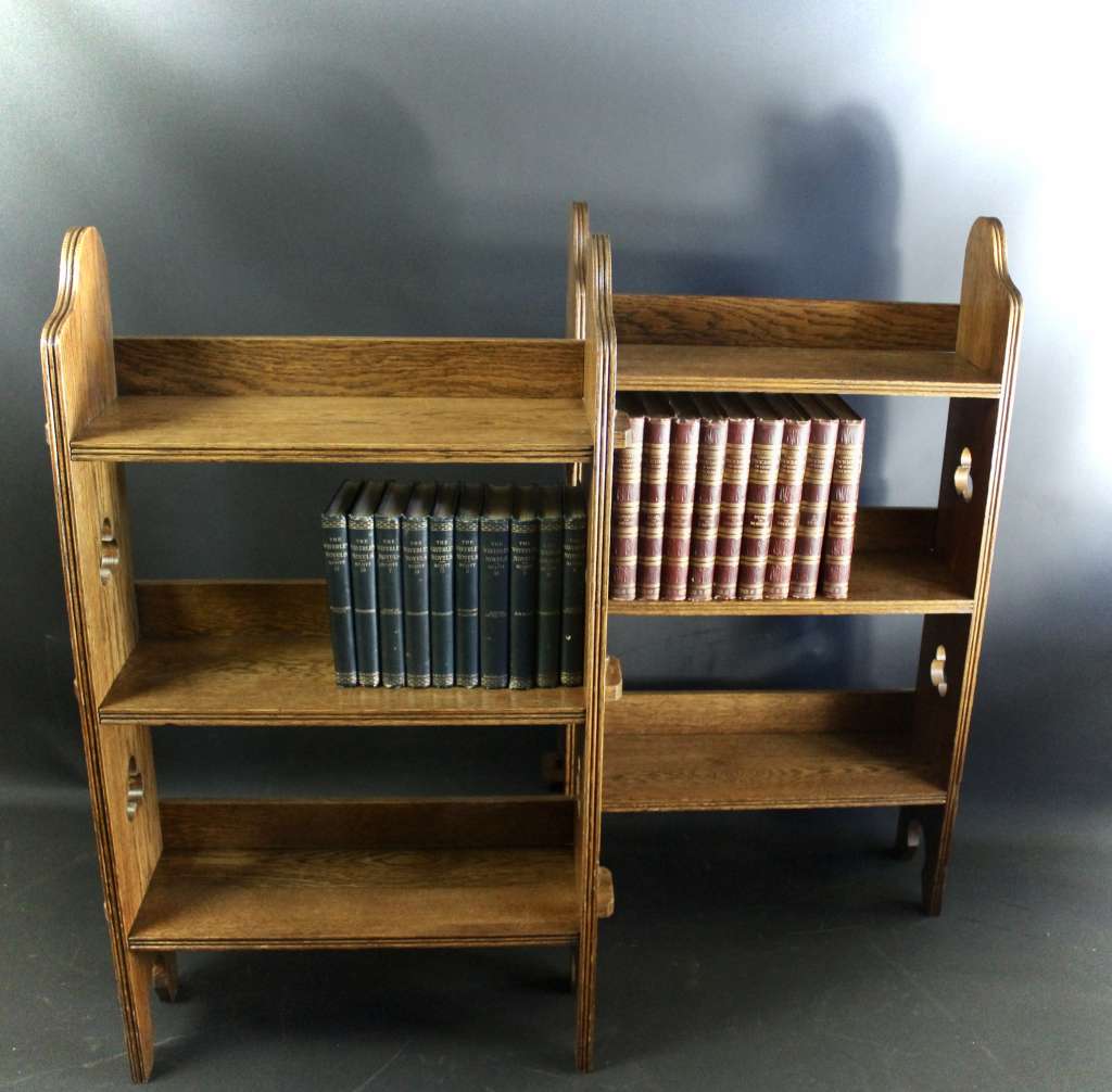 A Pair of Arts and Crafts oak open bookshelves,
