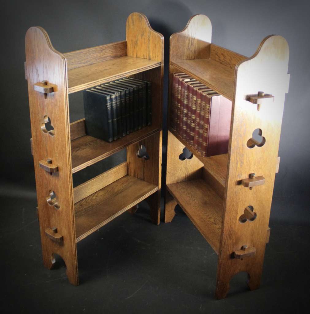 A Pair of Arts and Crafts oak open bookshelves,