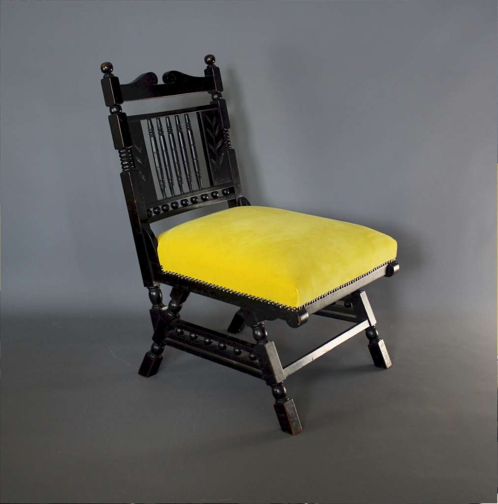 Aesthetic Movement Ebonised fireside chair.