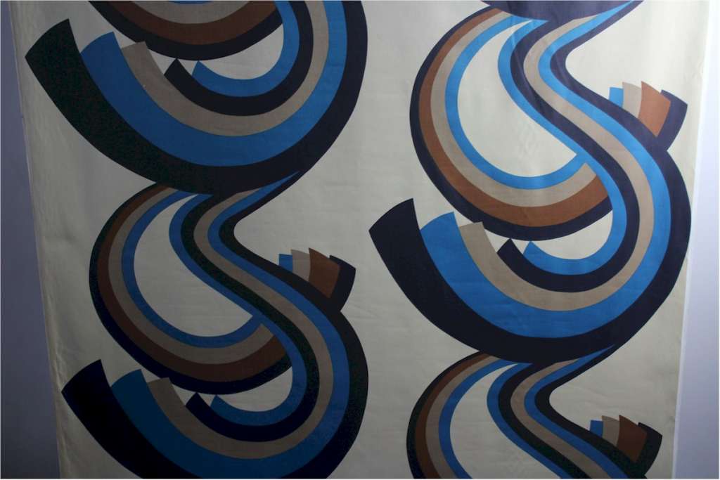 A Roll of 1970,s fabric swirling blue and brown geometric pattern