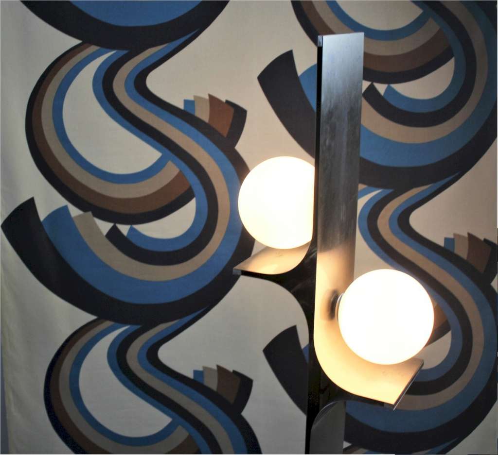 A Roll of 1970,s fabric swirling blue and brown geometric pattern