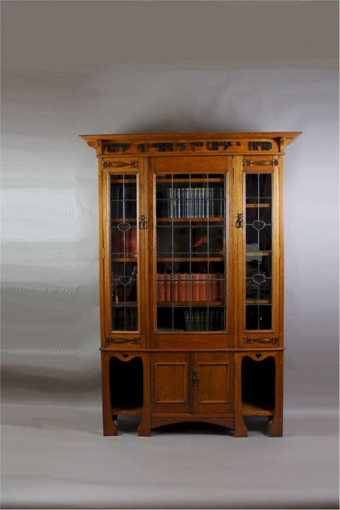 Arts and Crafts oak glazed bookcase with Motto,