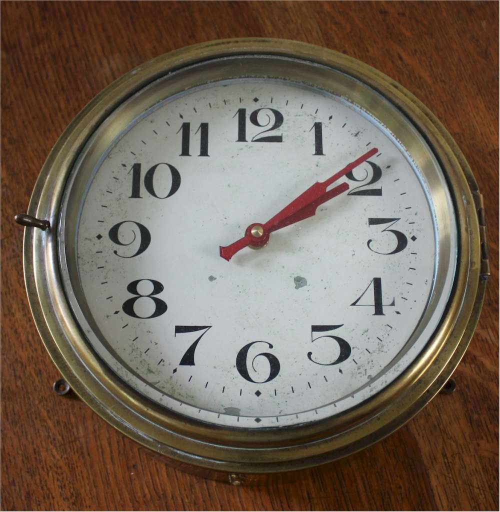 Antique brass Ships clock with  Arabic numerals