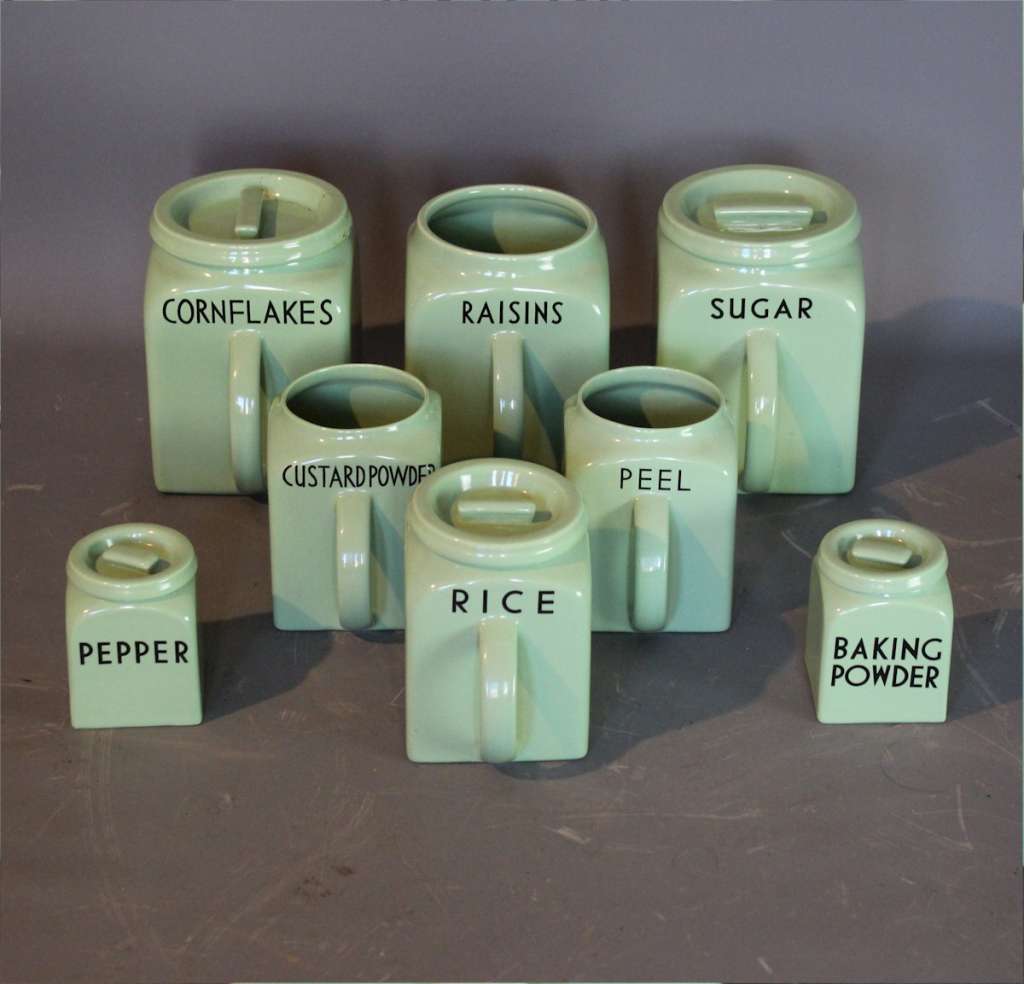 Part collection of Bristol Ware green kitchen containers.