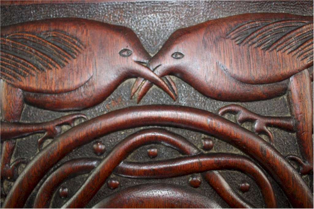 Arts and crafts table with carved birds c1900