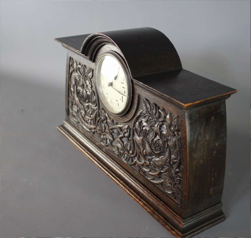 Arts and crafts carved oak mantle clock