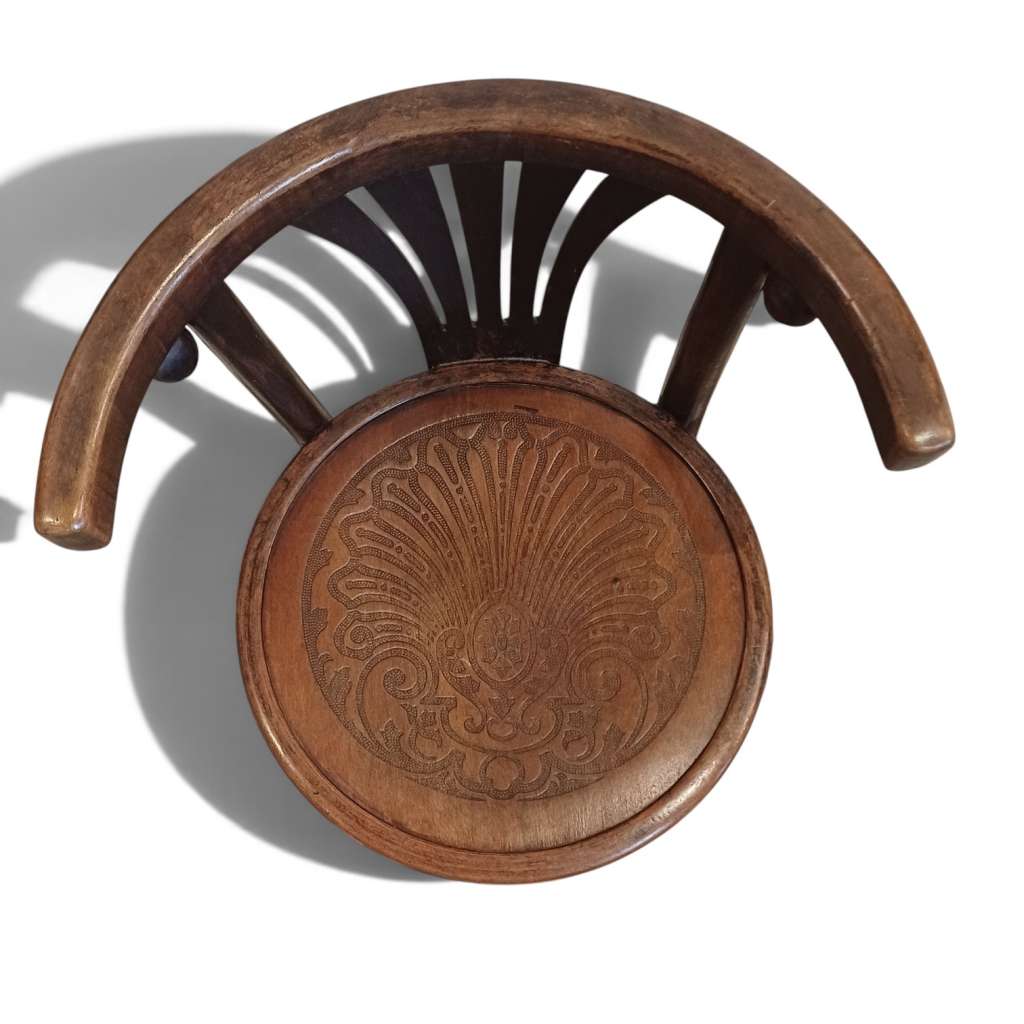 A Bentwood Childs chair with curved back
