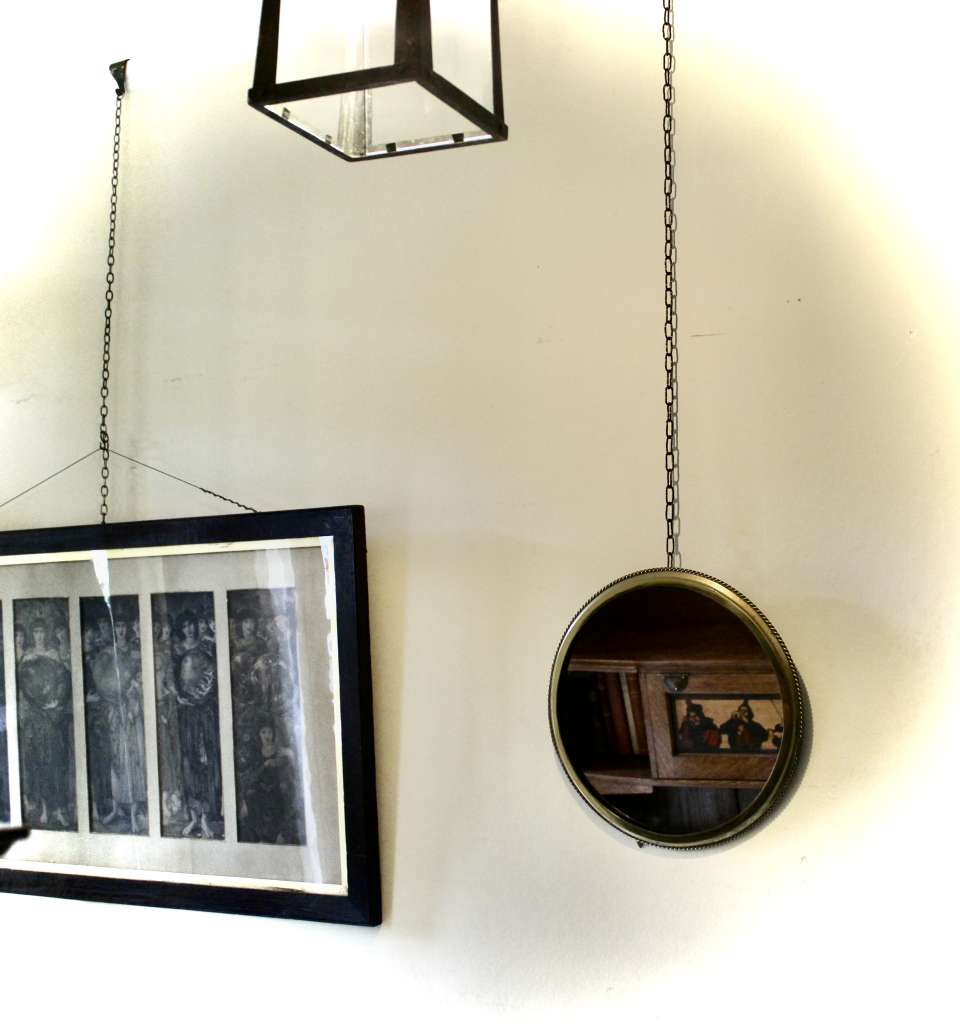 Circular brass ribbed wall mirror