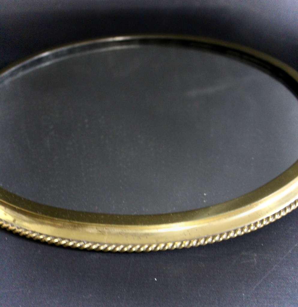 Circular brass ribbed wall mirror