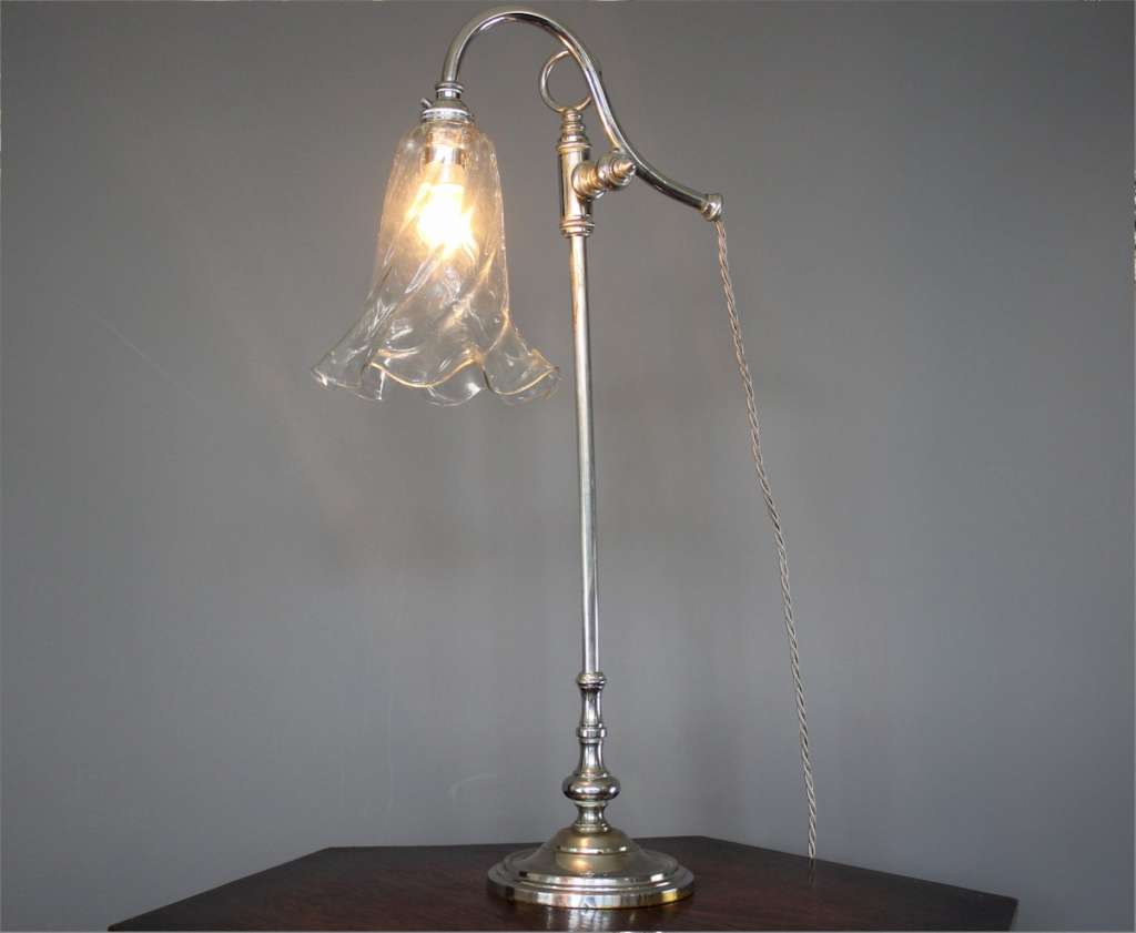 Elegant Edwardian adjustable table lamp with clear glass shade. Elegant Edwardian adjustable table l