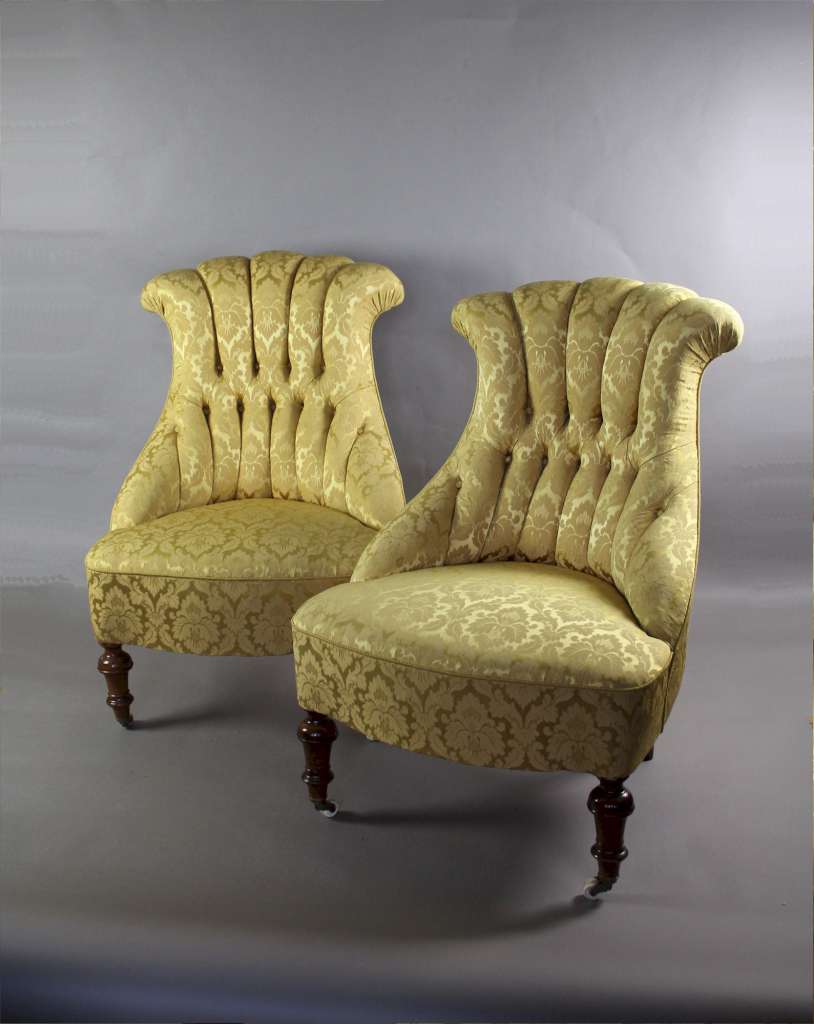 Pair of Victorian button backed armchairs in gold patterned fabric
