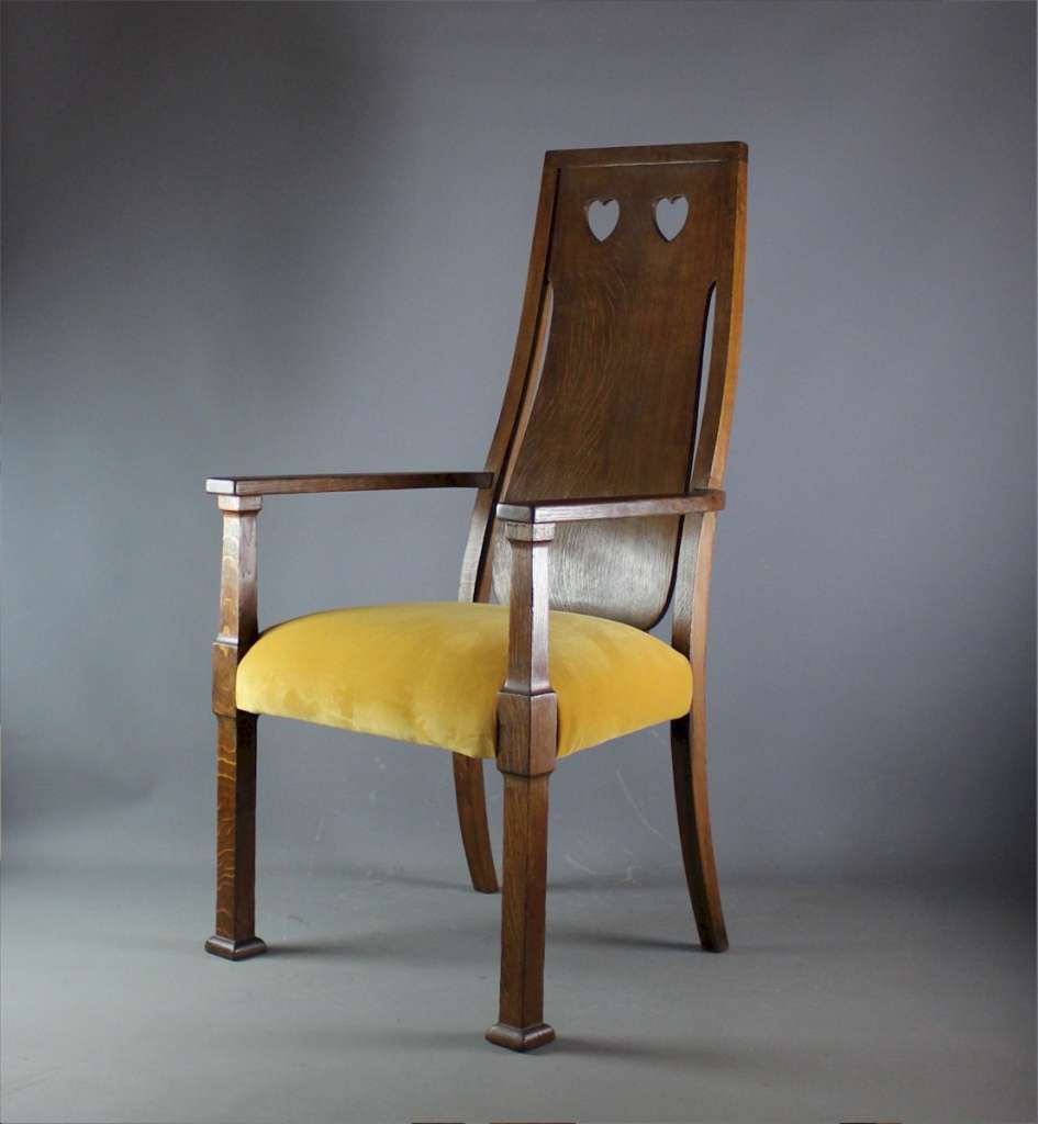 Arts and crafts oak carver chair by Goodyers.