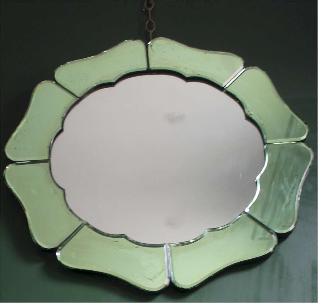 An Art Deco green mirror