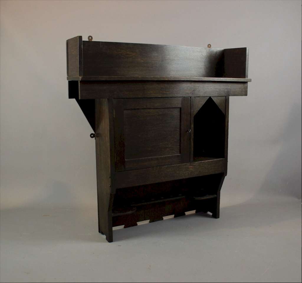 Arts and Crafts wall cabinet in oak by Liberty & Co