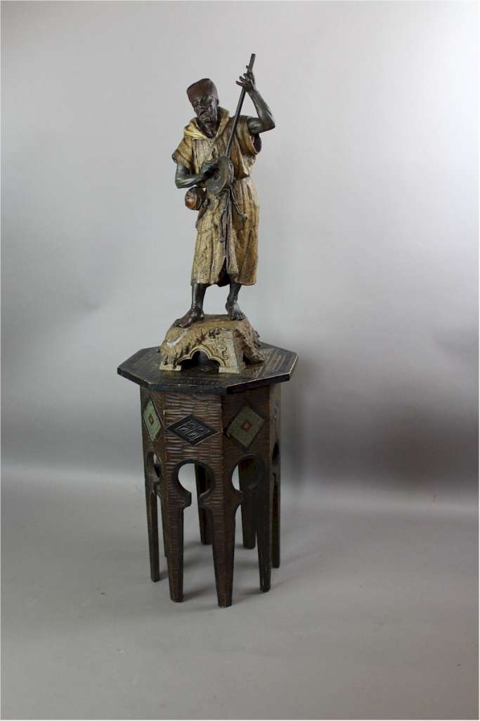 Large spelter figure of an Arab Bedouin playing the mandolin