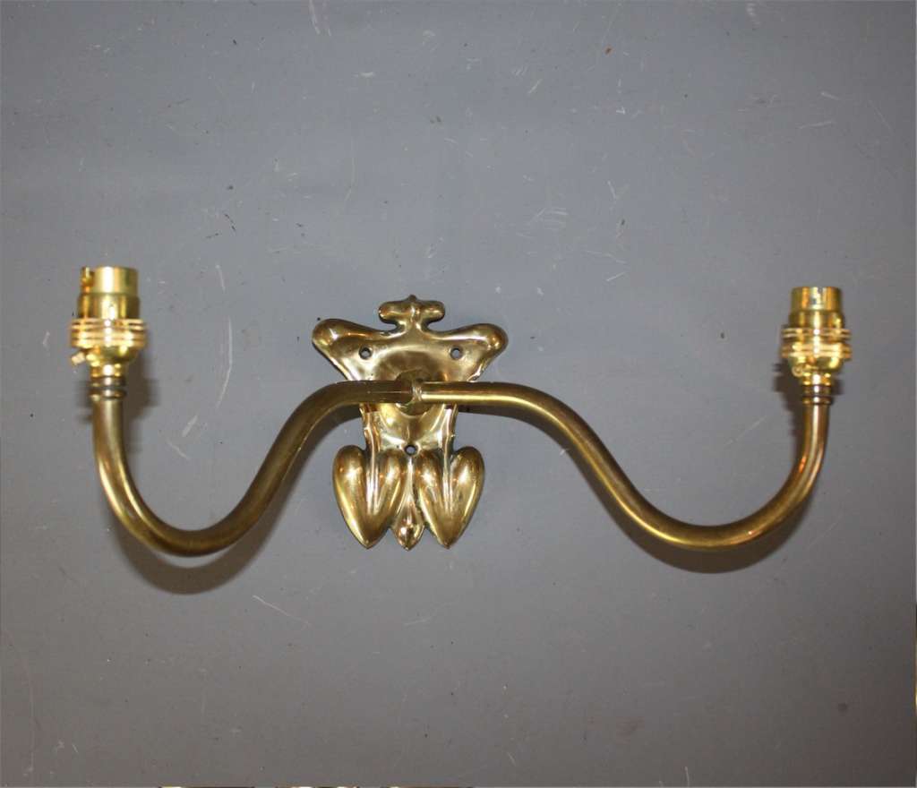 Pair of arts and crafts brass wall lights