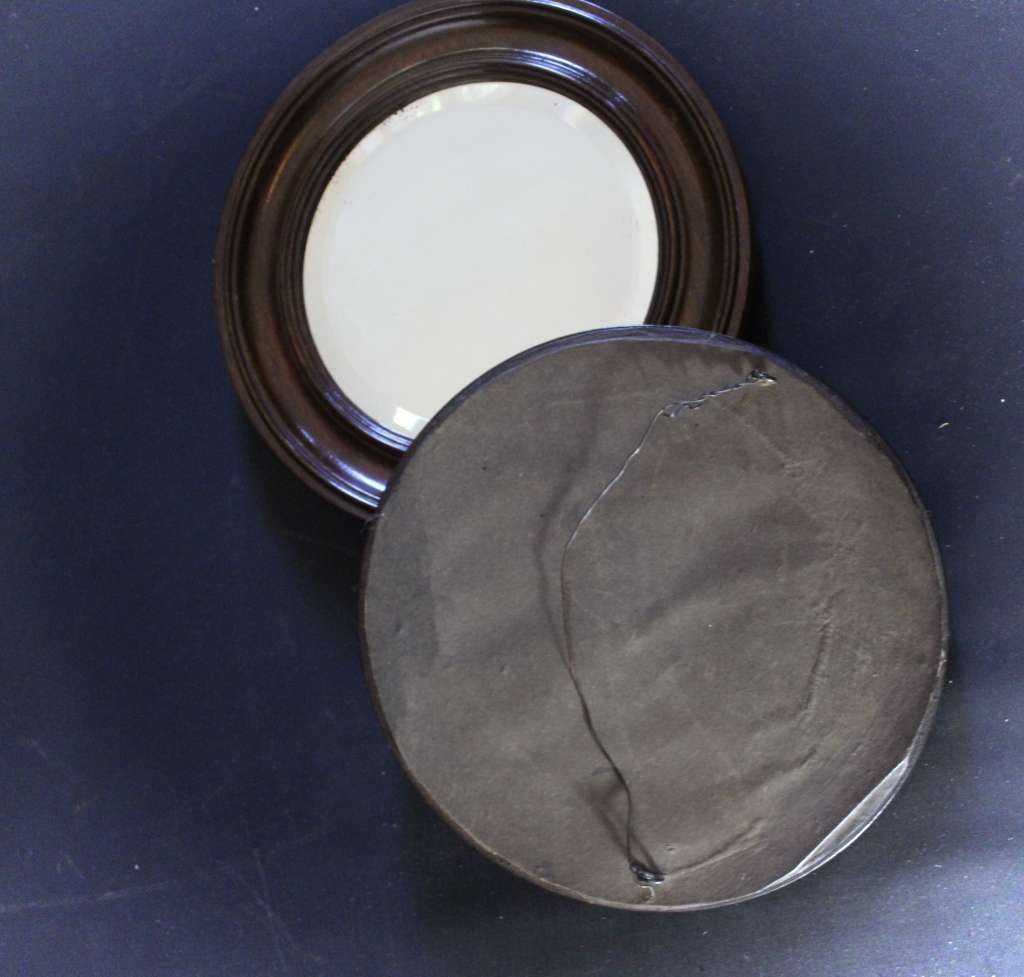 pair of oak framed circular mirrors