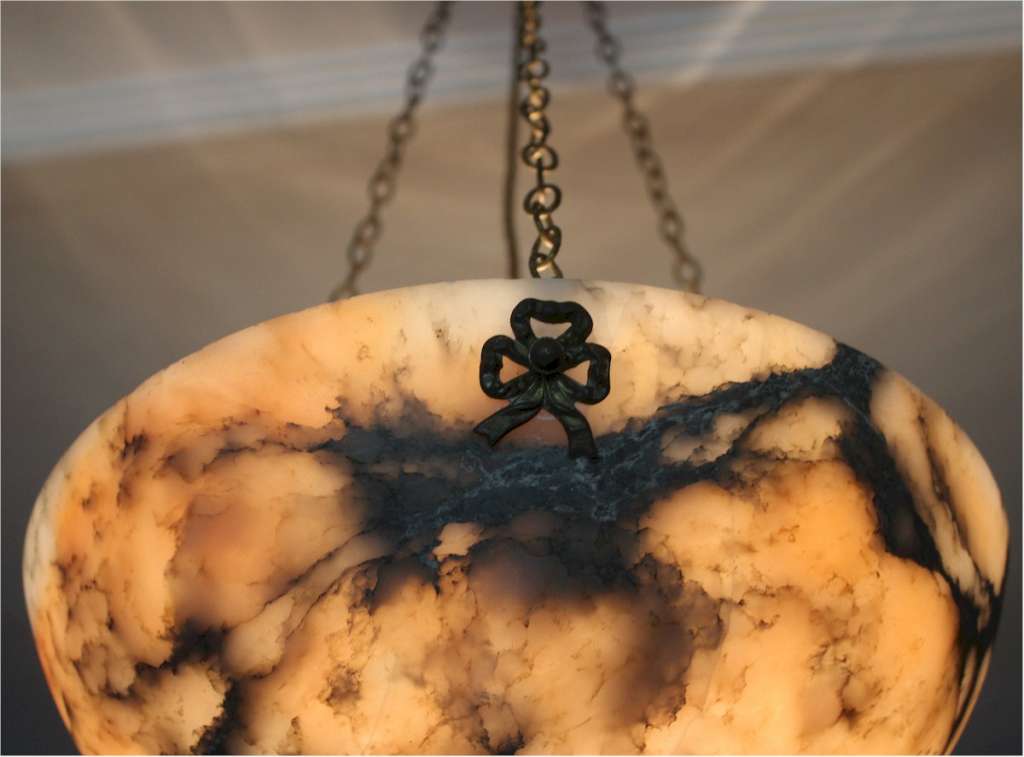 Alabaster ceiling shade with pinkish grain.