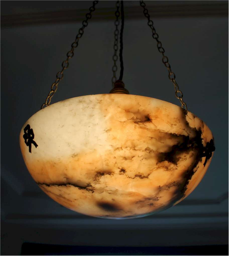 Alabaster ceiling shade with pinkish grain.