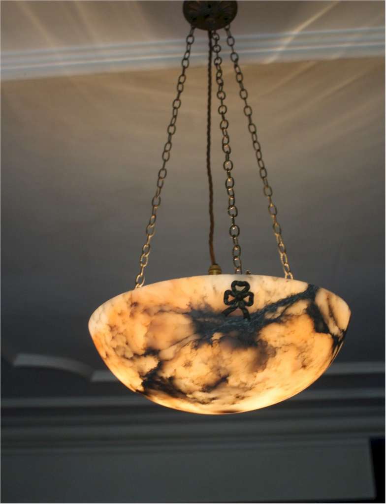 Alabaster ceiling shade with pinkish grain.