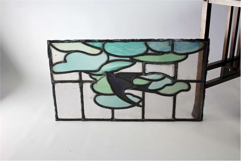 Arts and Crafts stained glass panel with Swallow
