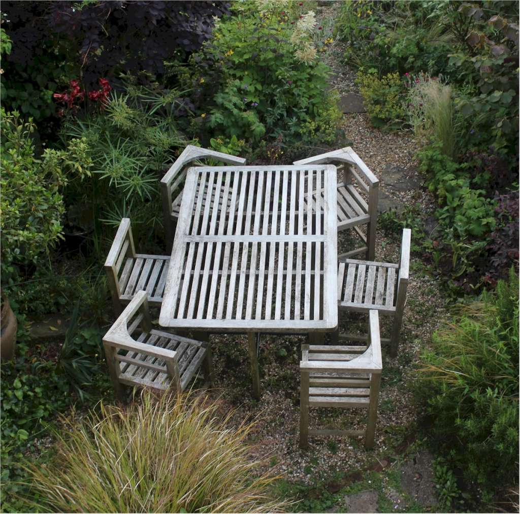 Six seater teak garden set in the manner of Heals