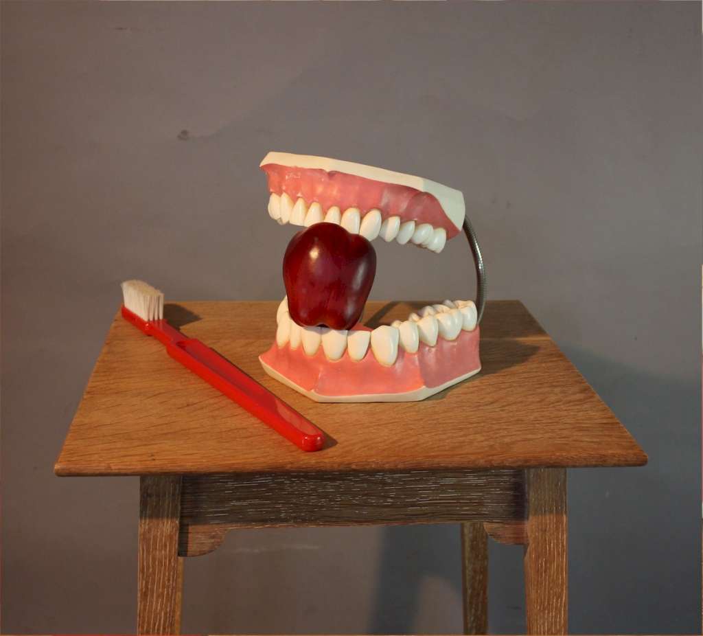 Oversized advertising set of teeth and toothbrush