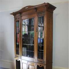 Arts and Crafts glazed bookcase with hearts