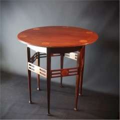Art Nouveau mahogany centre table by JS Henry