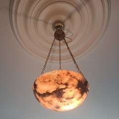 Alabaster ceiling shade with pinkish grain.