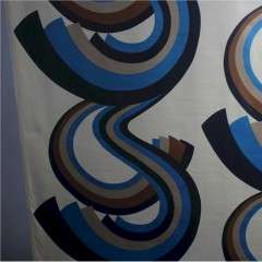 A Roll of 1970,s fabric swirling blue and brown geometric pattern