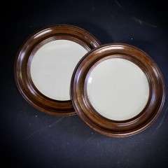 pair of oak framed circular mirrors