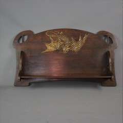 Arts and Crafts wall shelf with dragon