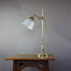 Arts and Crafts brass table with vaseline shade