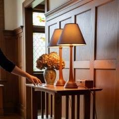 Arts and Crafts lamps in the manner of Voysey