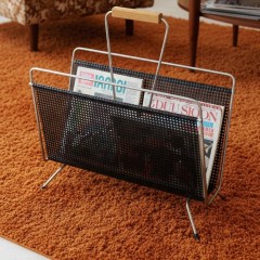 Perforated magazine rack from the 1950's