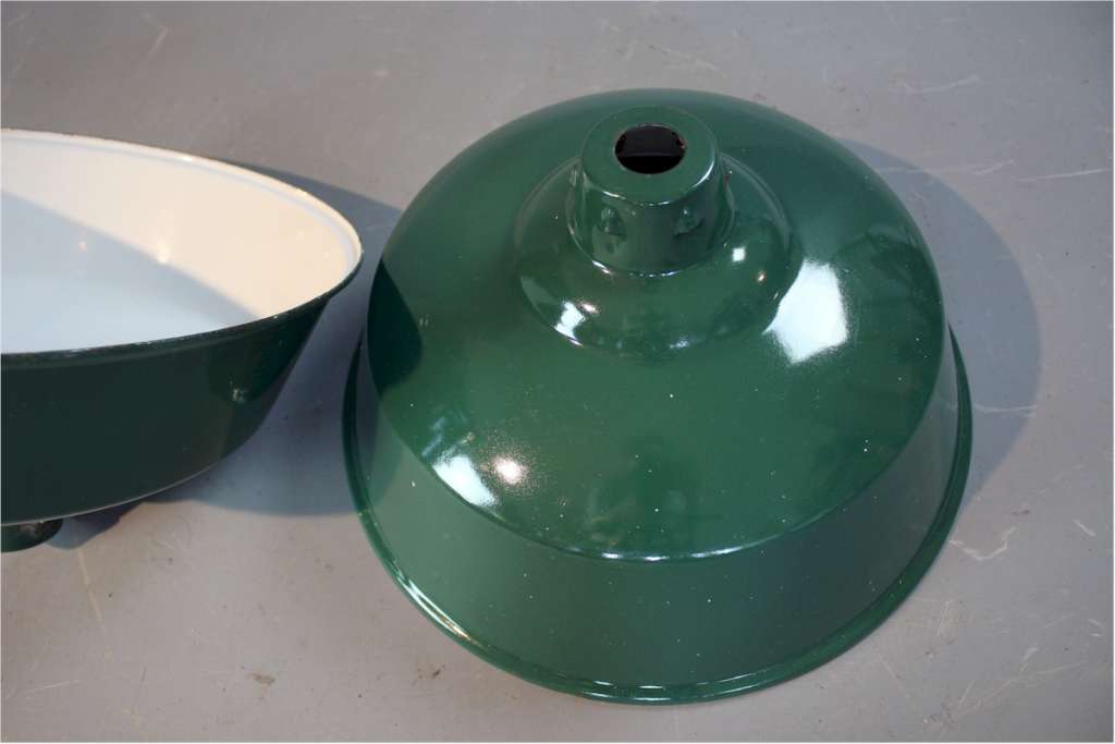 Two green enamelled industrial shades.