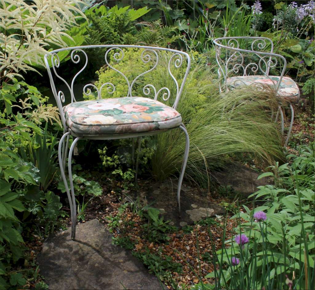 Pair of decorative metal garden chairs