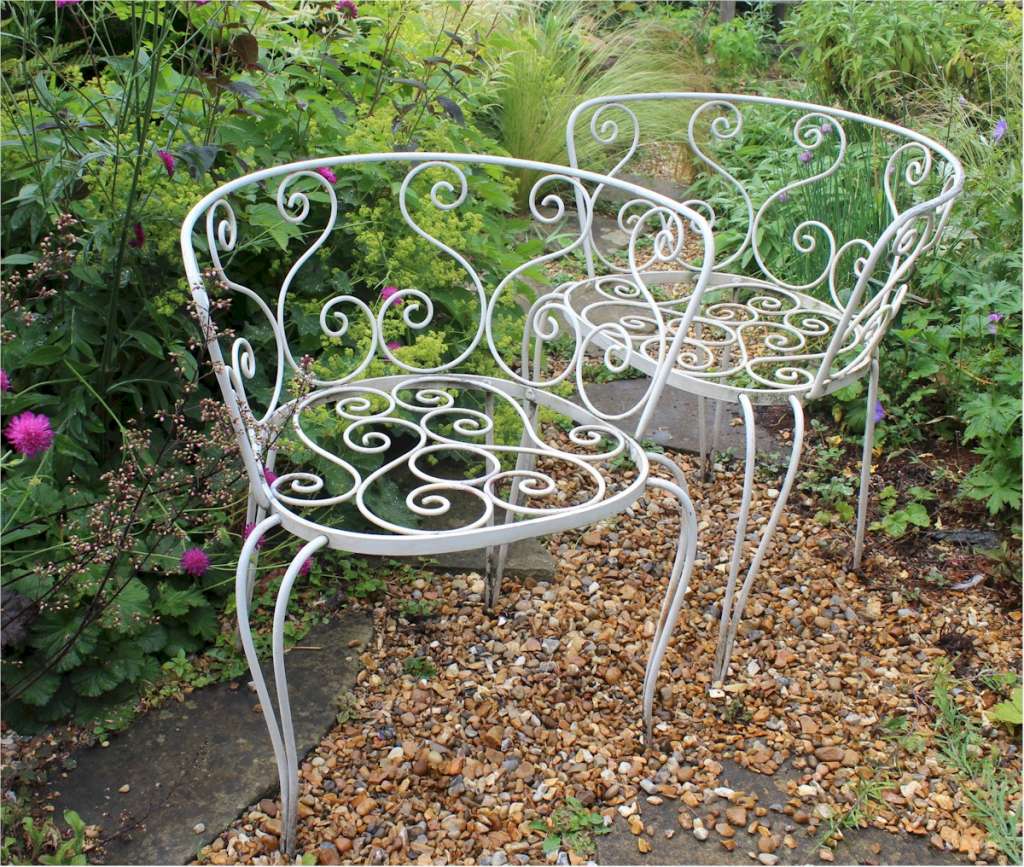 Pair of decorative metal garden chairs