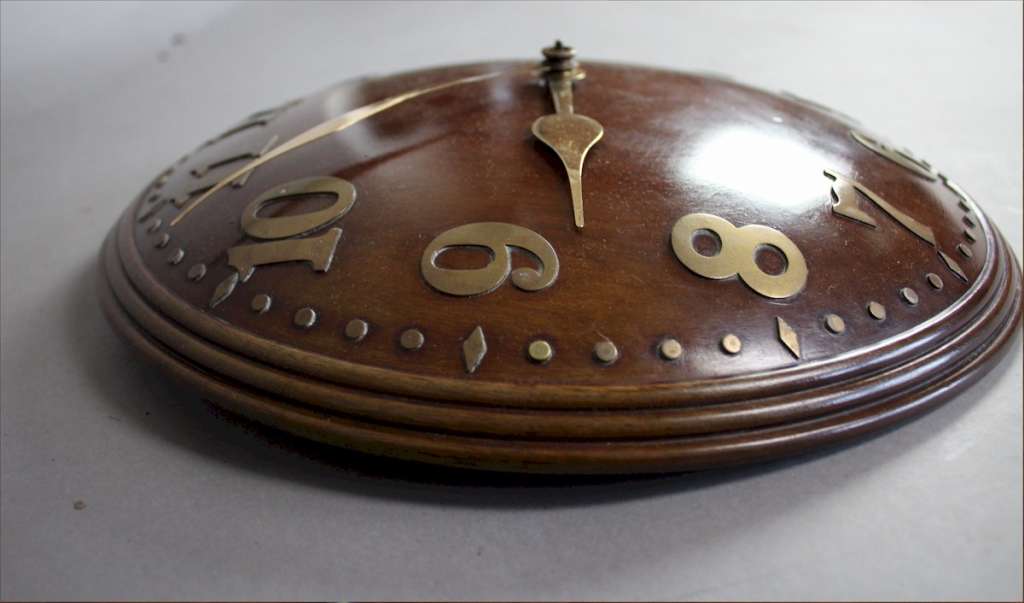 1930's concave  wall clock in walnut with  brass numerals, by Zenith